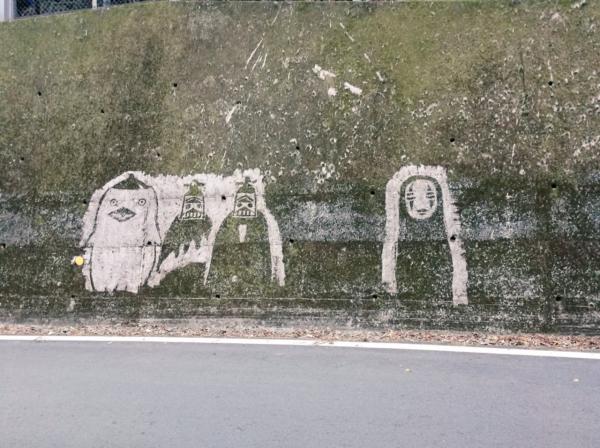 The Ghibli characters appear mysteriously on the moss wall in Japan